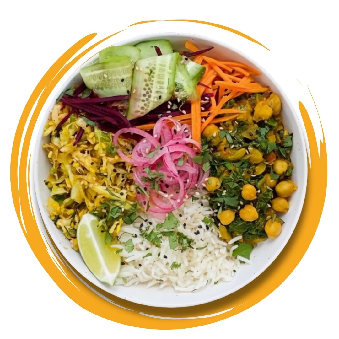 Colorful vegetarian bowl with rice, chickpeas, pickled onions, cucumber, carrots, and greens, presented as a healthy Meal subscription in Kolkata.