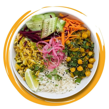 Colorful vegetarian bowl with rice, chickpeas, pickled onions, cucumber, carrots, and greens, presented as a healthy Meal subscription in Kolkata.