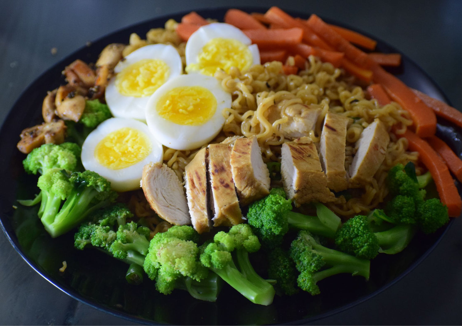 Delicious ramen bowl with chicken and vegetables, offering a colorful and nutritious meal option for healthy office meals in Kolkata.